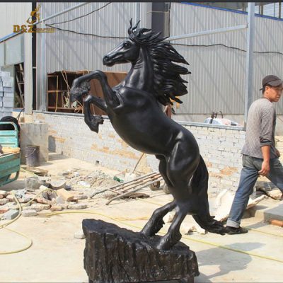 bronze horse statue with clock